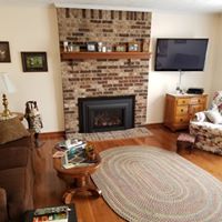 Living room with a fireplace by Norther Comfort Heating and Cooling in Rochester and Walworth, NY